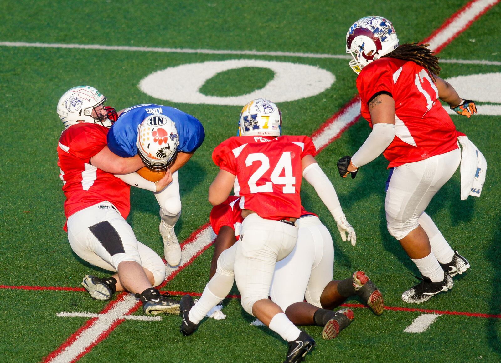 The West’s Chase Luckett of Badin sacks East quarterback Blake King of Milford during the 43rd Southwestern Ohio Football Coaches Association Ron Woyan East-West All-Star Game on Thursday night at Kings. NICK GRAHAM/STAFF