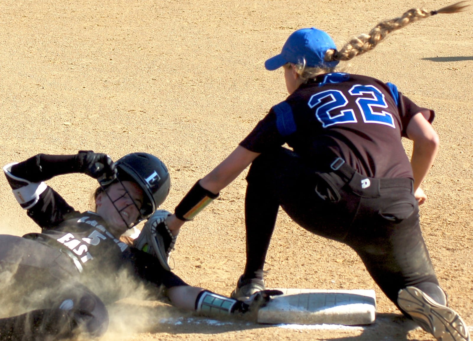 Lakota East’s Brianna Castner is out at third base after the tag by Springboro’s Sophie Weber during Monday’s Division I sectional final at West Carrollton. CONTRIBUTED PHOTO BY JOHN CUMMINGS