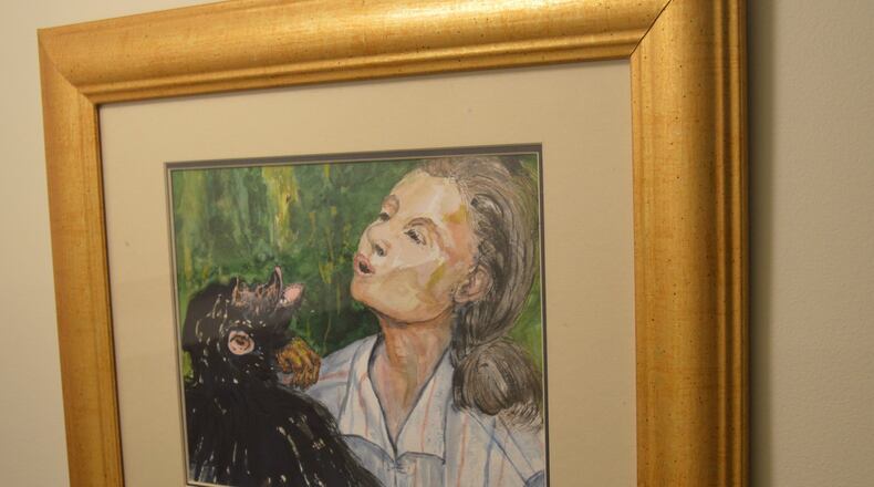 Hanging in in the stairwell leading to her basement is this water color of Jane Goodall painted by E.J. DeVore. CONTRIBUTED/BOB RATTERMAN