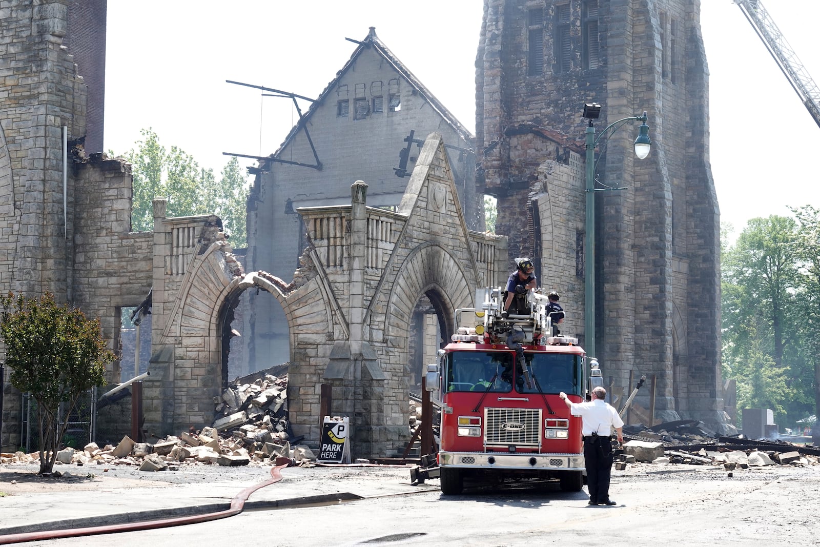 FILE - Firefighters gather outside the historic Clayborn Temple, a landmark from the civil rights movement with ties to Martin Luther King Jr., after it caught fire, April 28, 2025, in Memphis, Tenn. (AP Photo/Karen Pulfer Focht, File)