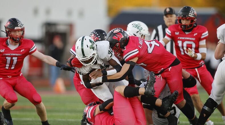 Mason's Shelvon Hibbett carries the ball during their football game Friday, Sept. 30, 2022 at Lakota West High School in West Chester Township. Lakota West defeated Mason 37-7. NICK GRAHAM/STAFF