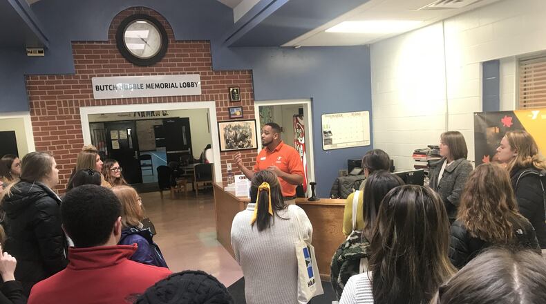 Samuel Broyles III, center director of Hamilton’s Booker T. Washington Community Center, tells Miami University students and faculty about the center as part of the group’s tour of Butler County city. The first-time tour was arranged through a joint effort with Hamilton Schools and include six of the city school system’s schools.
