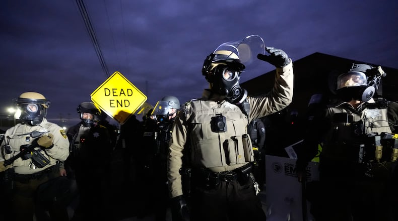 Law enforcement standoff with protesters outside an ICE processing facility in the Chicago suburb of Broadview, Ill., Saturday, Nov. 1, 2025. (AP Photo/Alex Brandon)