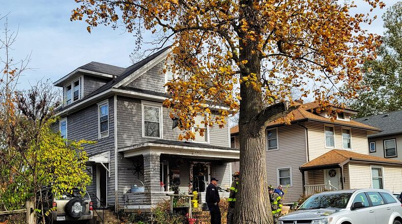 Two people were rescued from this house fire this morning in the 2300 block of Christel Avenue in Middletown. NICK GRAHAM/STAFF