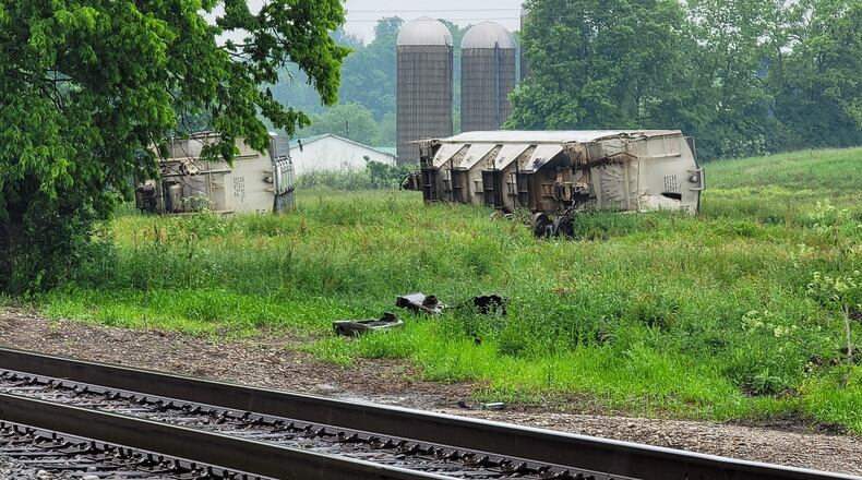 Workers have been in Wayne Twp. for a few weeks cleaning up wrecked railroad cars from a November Norfolk Southern Railroad derailment at U.S. 127. NICK GRAHAM / STAFF