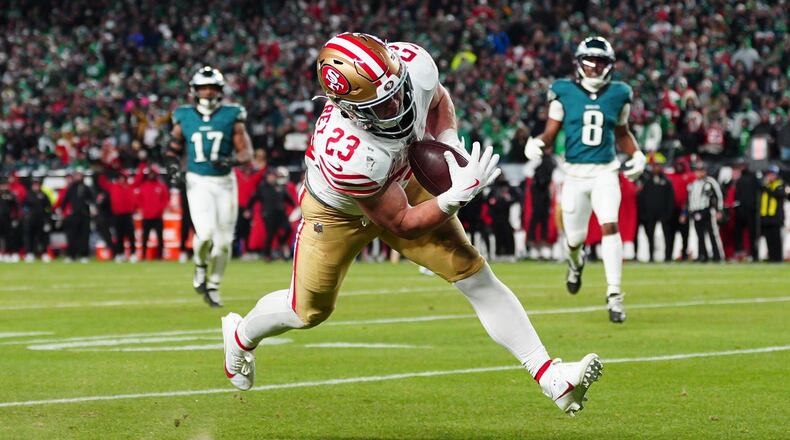 San Francisco 49ers running back Christian McCaffrey scores a touchdown during the second half of an NFL wild-card playoff football game against the Philadelphia Eagles on Sunday, Jan. 11, 2026, in Philadelphia. (AP Photo/Derik Hamilton)