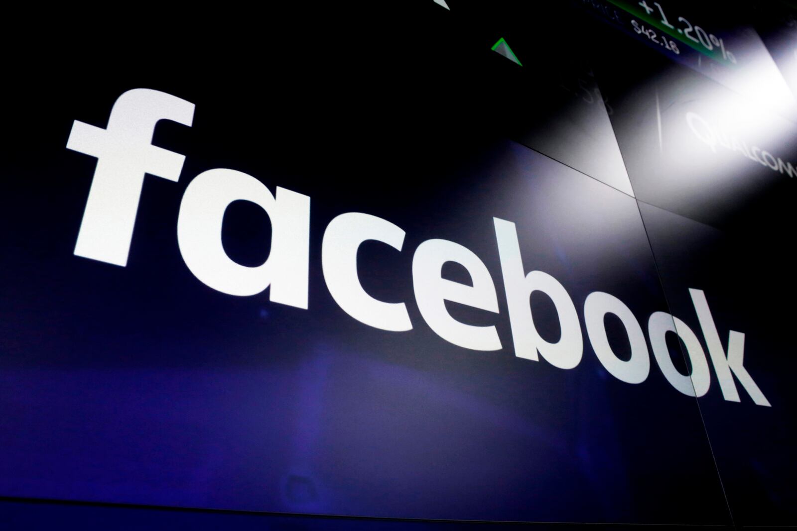 FILE - The logo for Facebook appears on screens in New York's Times Square on March 29, 2018. (AP Photo/Richard Drew, File)