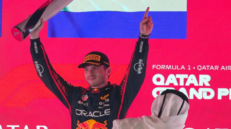 Red Bull driver Max Verstappen of the Netherlands celebrates after winning the Qatar Formula One Grand Prix, in Lusail, Qatar, Sunday, Nov. 30, 2025.(AP Photo/Altaf Qadri)