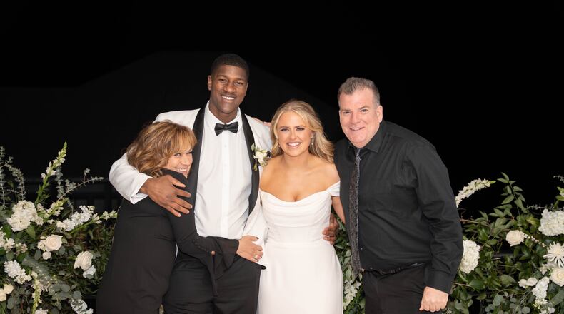 From left: Dulcie Martin, Chris Hudson, Catherine Hudson, Chuck Martin at the Hudson’s wedding on Rosemary Beach in Florida’s Panhandle last February. CONTRIBUTED