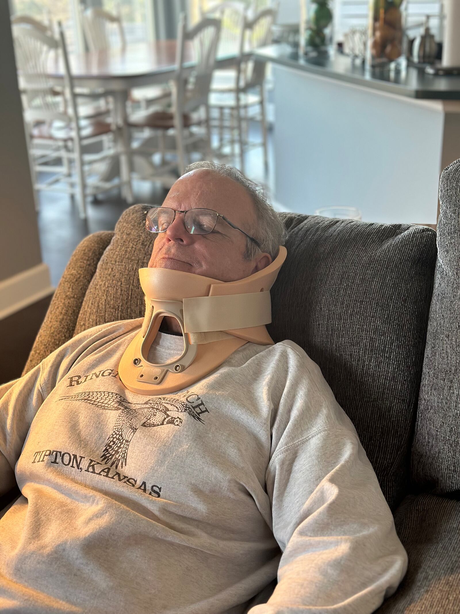 Paul at home in a neck brace prior to his surgery at UC Health. Post surgery, he didn't have to wear the brace and had no pain.