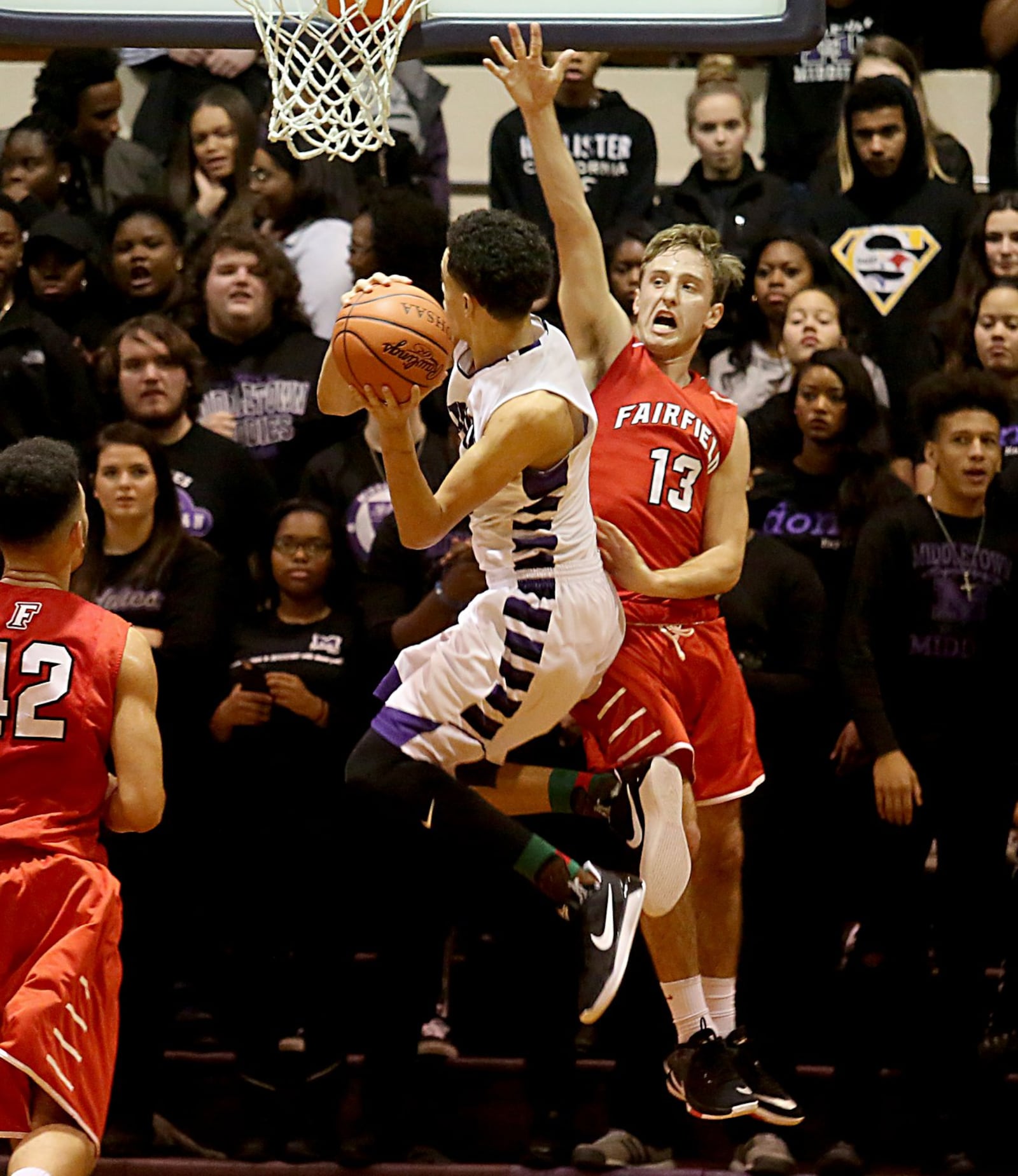 Middletown’s Cliff Snow goes up to shoot as Fairfield’s Kyle Schimpf goes up to defend during their game at Wade E. Miller Gym in Middletown on Jan. 3. CONTRIBUTED PHOTO BY E.L. HUBBARD