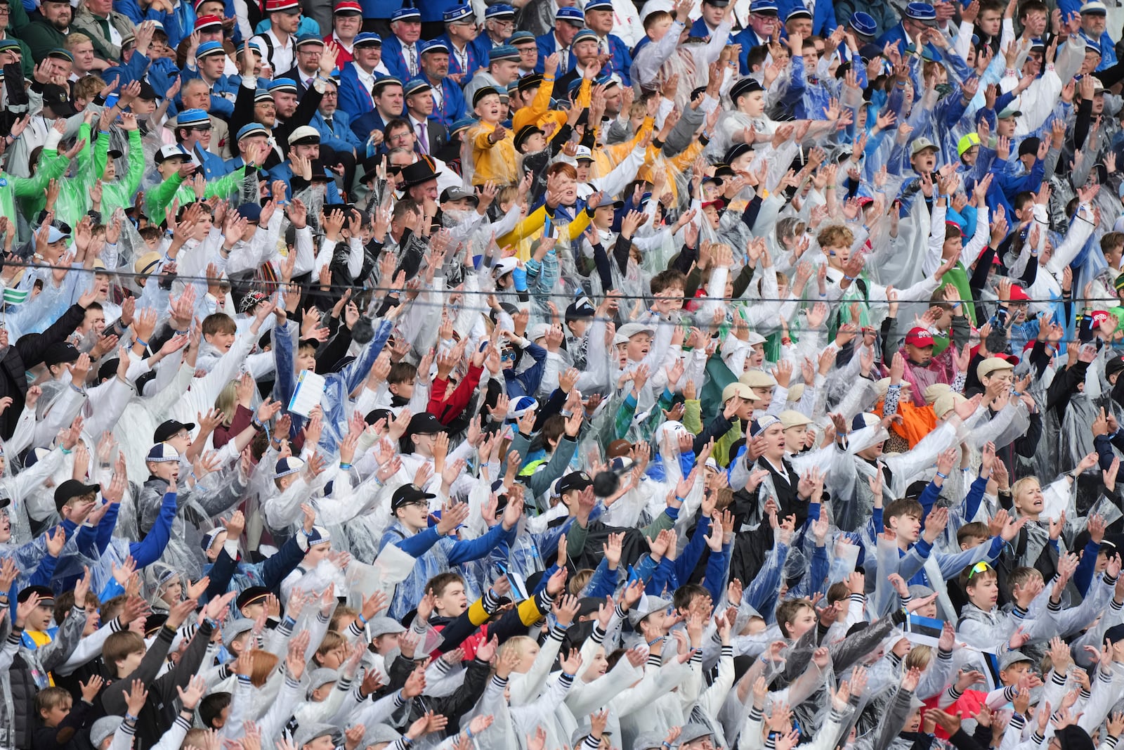 Choir singers attend the "Iseoma" Song and Dance Celebration at the Song Festival Grounds in Tallinn, Estonia, on Sunday, July 6, 2025. (AP Photo/Sergei Grits)