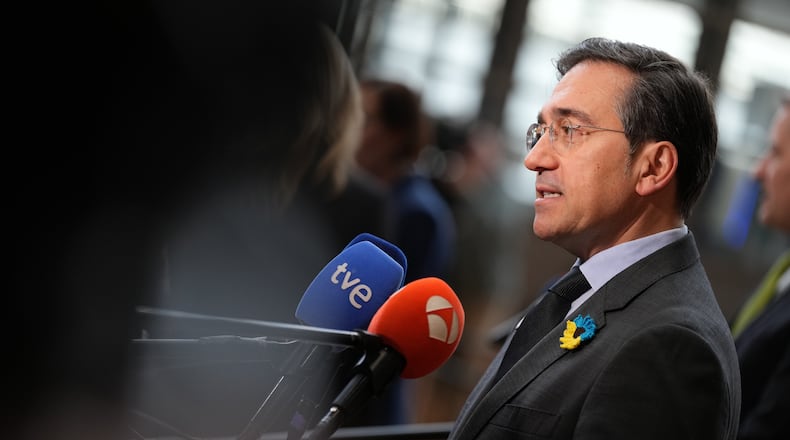 Spain's Foreign Minister Jose Manuel Albares Bueno speaks with the media as he arrives for a meeting of EU foreign ministers at the European Council building in Brussels, Monday, Feb. 23, 2026. (AP Photo/Virginia Mayo)