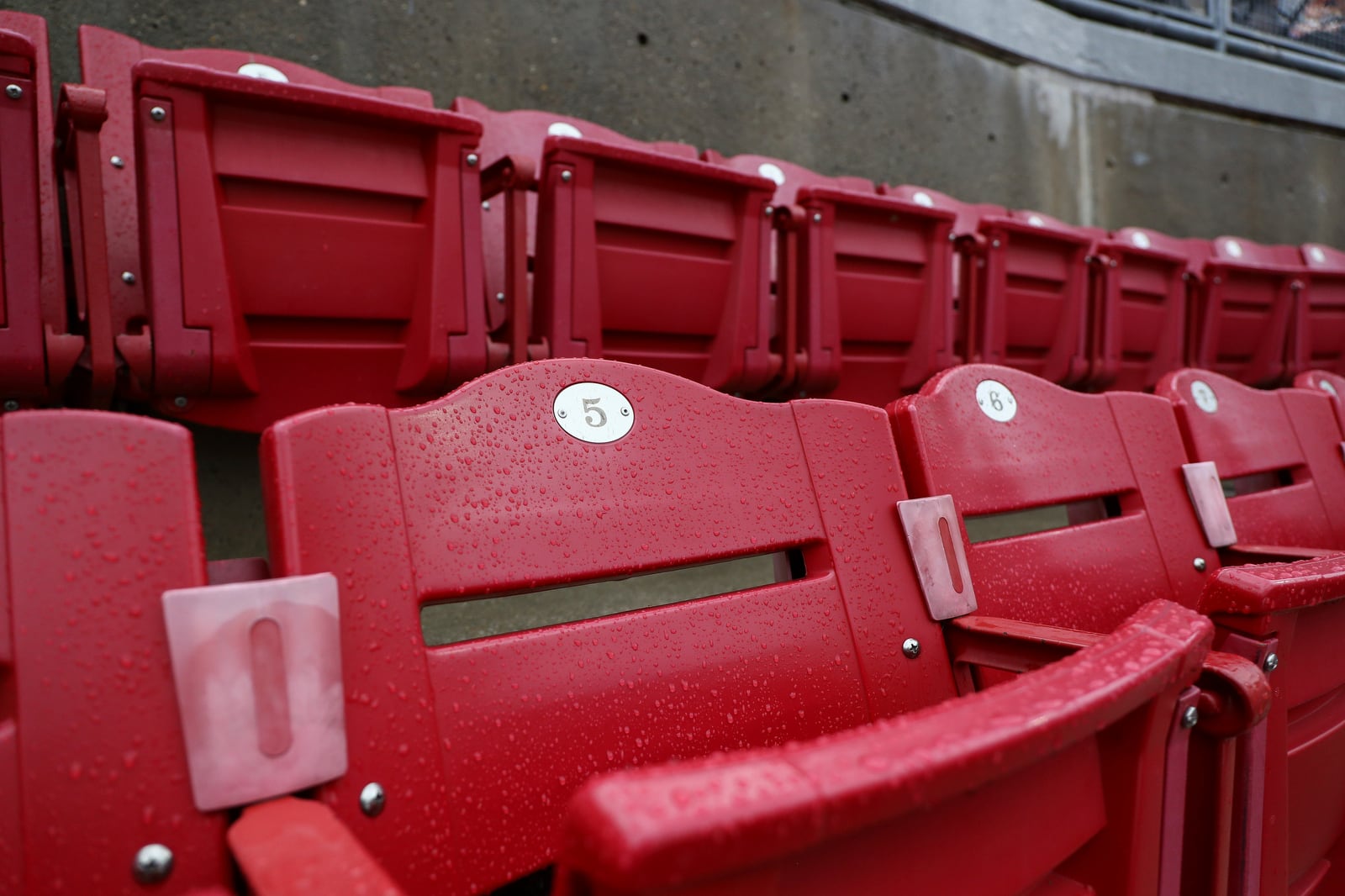 Droplets cling to seats at Great American Ballpark during a rain delay in a baseball game between the Cincinnati Reds and the St. Louis Cardinals, Thursday, May 1, 2025, in Cincinnati. (AP Photo/Abdoul Sow)