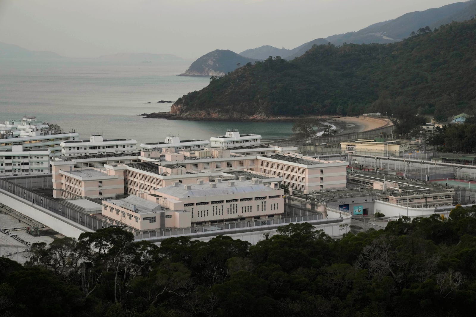 FILE -Exterior view of Shek Pik Prison is seen in Hong Kong, Jan. 19, 2022. (AP Photo/Kin Cheung), File)