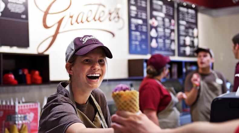 Graeter’s will be giving away free scoops of Elena’s Blueberry Pie ice cream to customers sometime between now and Sept. 17 as part of Cones for the Cure. NICK GRAHAM/2015
