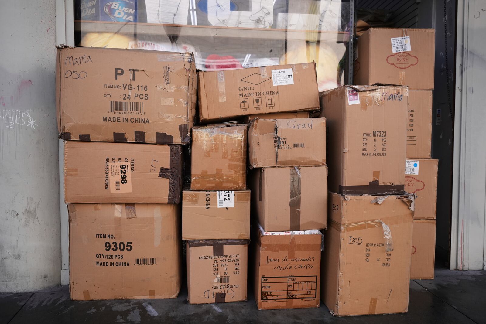 Boxes of party supplies imported from China are stacked outside a store in the Toy District of Los Angeles, Wednesday, April 9, 2025. (AP Photo/Jae C. Hong)