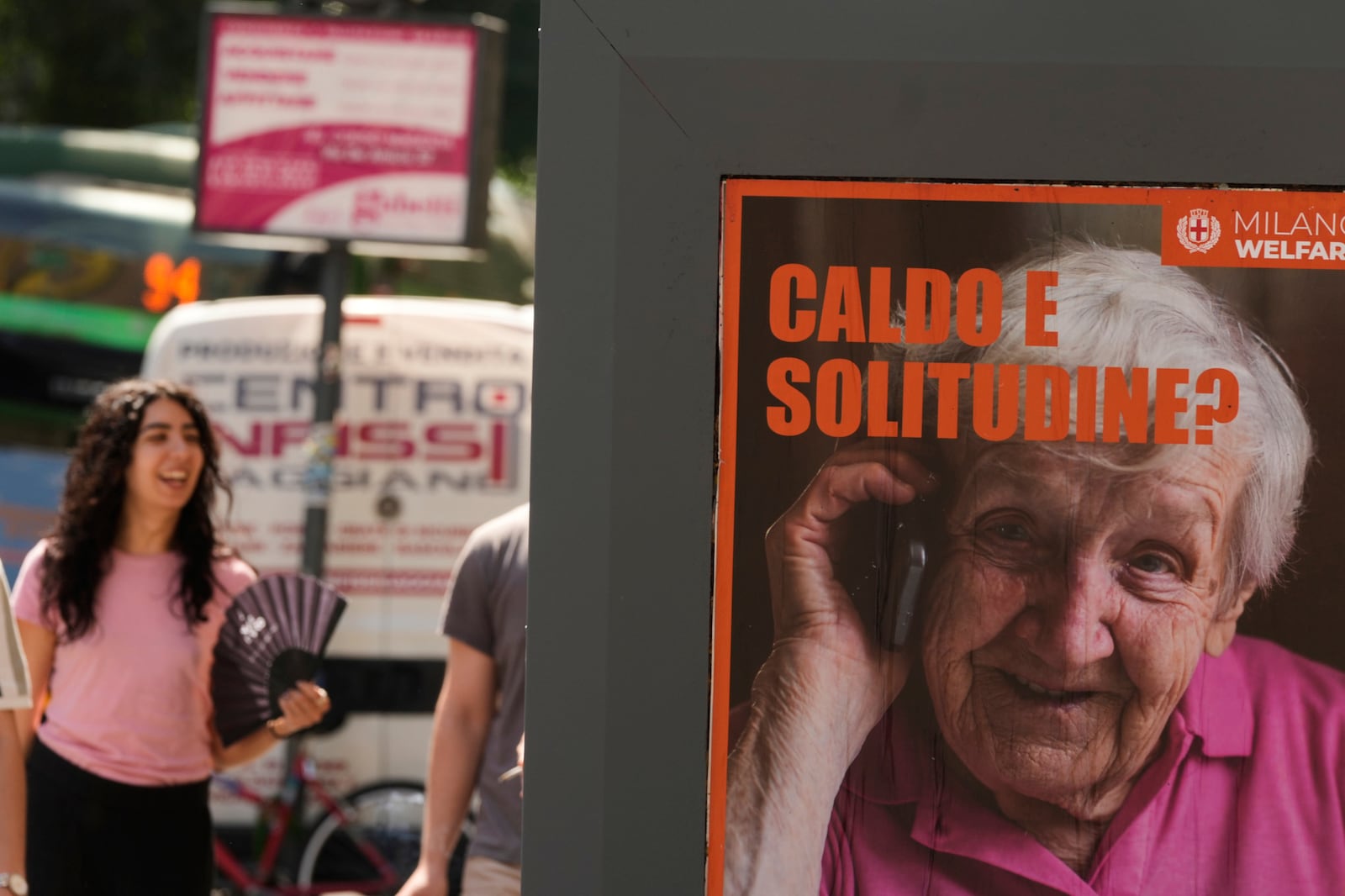 A billboard of the Municipality of Milan reads in Italian 'Hot and lonely?' in Milan, Italy, Tuesday, July 1, 2025. (AP Photo/Luca Bruno)