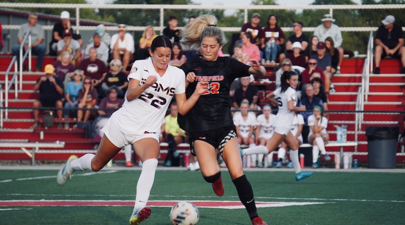 Fairfield junior Leaha Compton and Ross senior Caroline Chernock battle for possession during their game on Tuesday night at Christy Rose Dennis Memorial Stadium. Chris Vogt/CONTRIBUTED