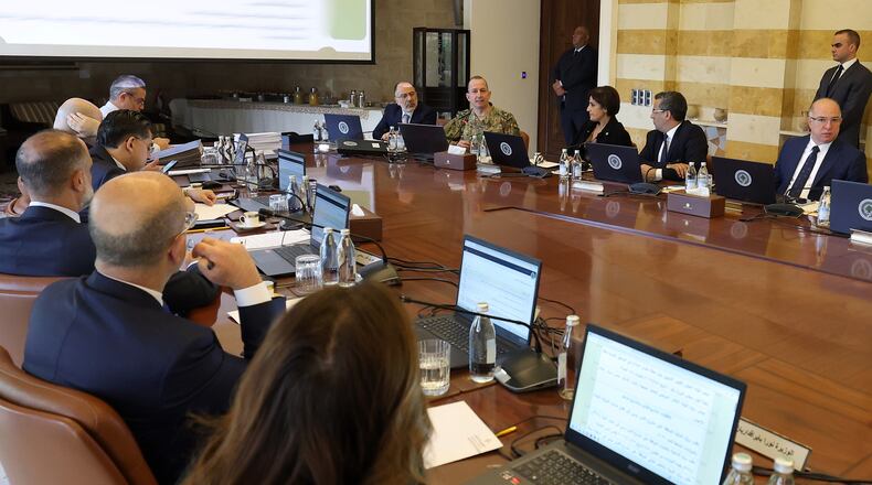 In this photo released by the Lebanese Presidency press office, Lebanese army chief Gen. Rudolph Haikal, second background left, speaks during a cabinet meeting at the presidential place in Baabda, east of Beirut, Lebanon, Thursday, Jan. 8, 2026. (Lebanese Presidency press office via AP)