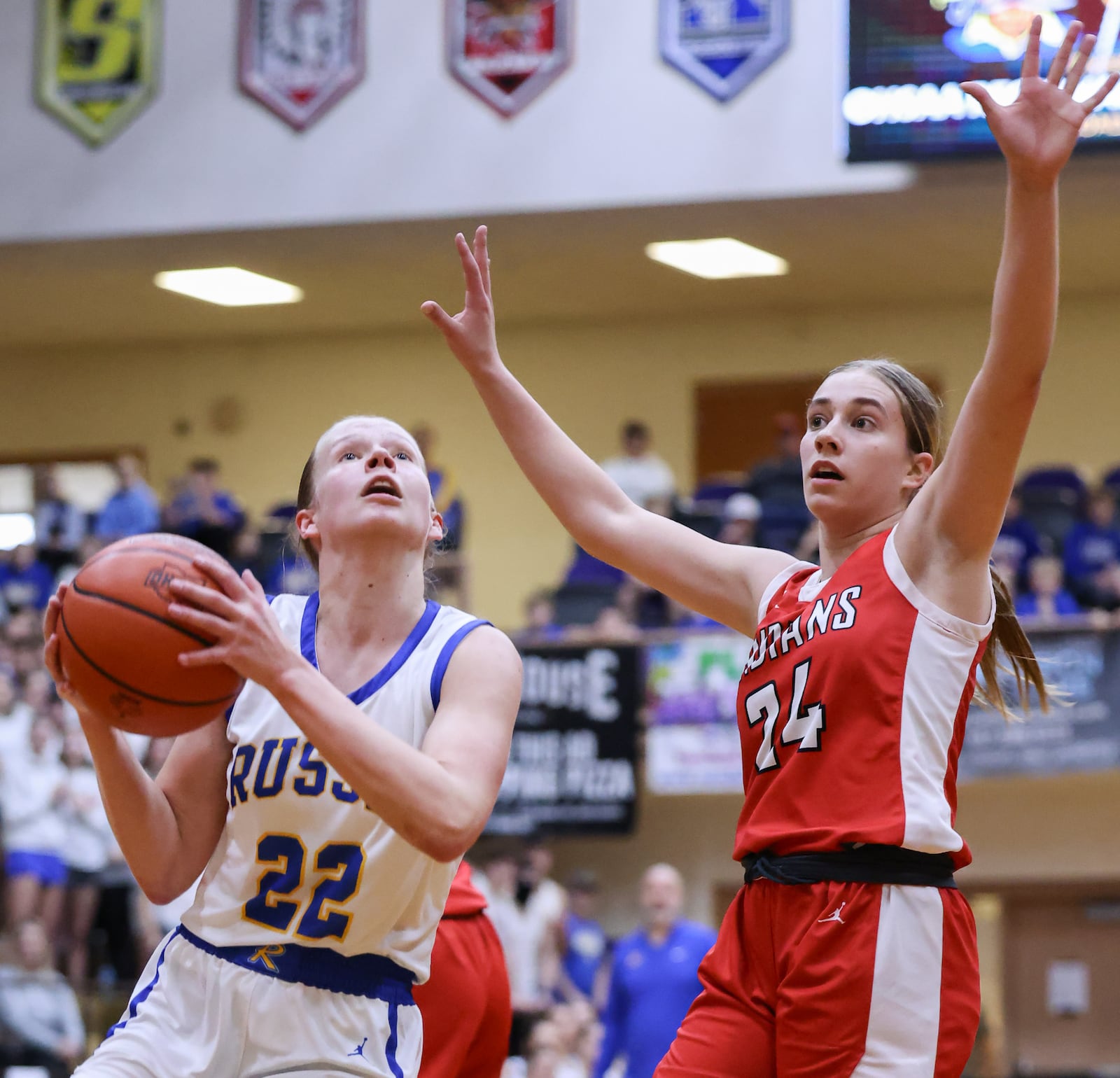 Russia junior forward Celeste Borchers shoots ahead of Cedarville's Maria Christian during a Division VII regional final on Saturday, March 7 at Vandalia-Butler's Student Activity Center. Borchers led the Raiders with 15 points and Christian led the Indians with 13. BRYANT BILLING / STAFF