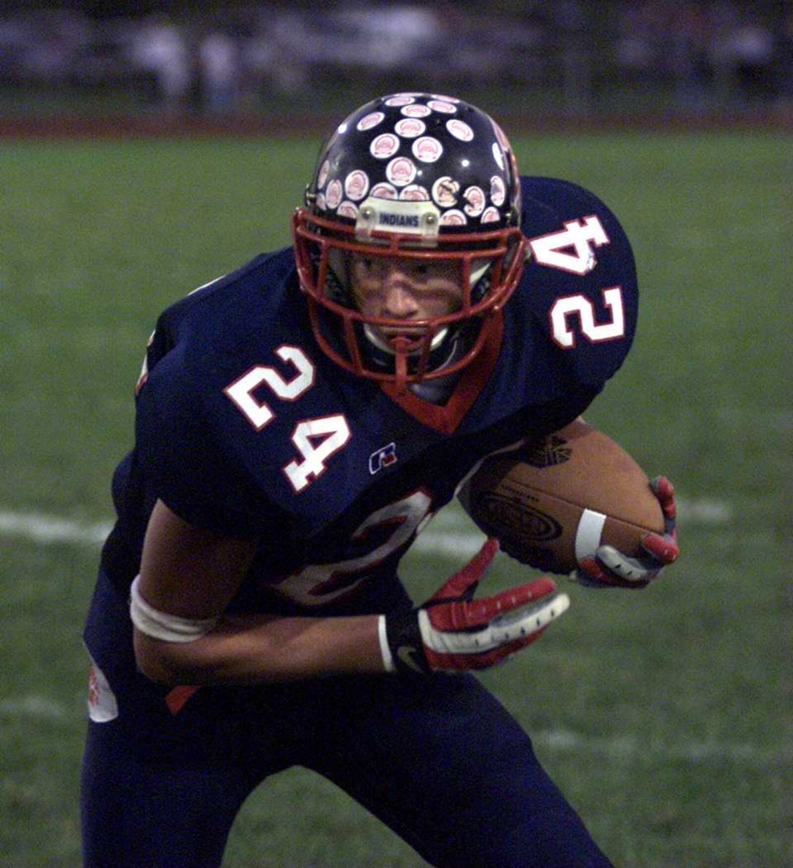 Piqua's Bryant Haines looks for open field after catching as pass vs. Butler in 2003. Jim Witmer/Staff