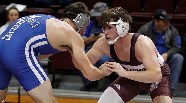 Bellarmine’s Andrew Sams (right) competes against Lindsey Wilson’s Lucas Miozza on Dec. 6 at Knights Hall in Louisville, Ky. Sams won the 184-pound match 6-3. PHOTO COURTESY OF BELLARMINE ATHLETICS