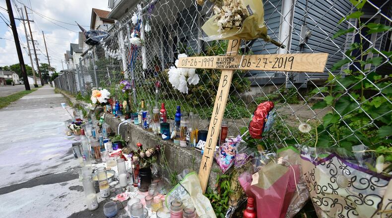 The memorial on East Avenue for Shon Walker, who was shot and killed July 2 has grown. NICK GRAHAM/STAFF