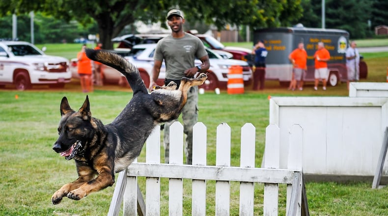 Chase, a Middletown canine officer, jumps a hurdle during last year’s National Night Out at Berachah Church. A similar demonstration is planned for this year’s event, set for 5 to 9 p.m. Tuesday, Aug. 7. NICK GRAHAM/STAFF
