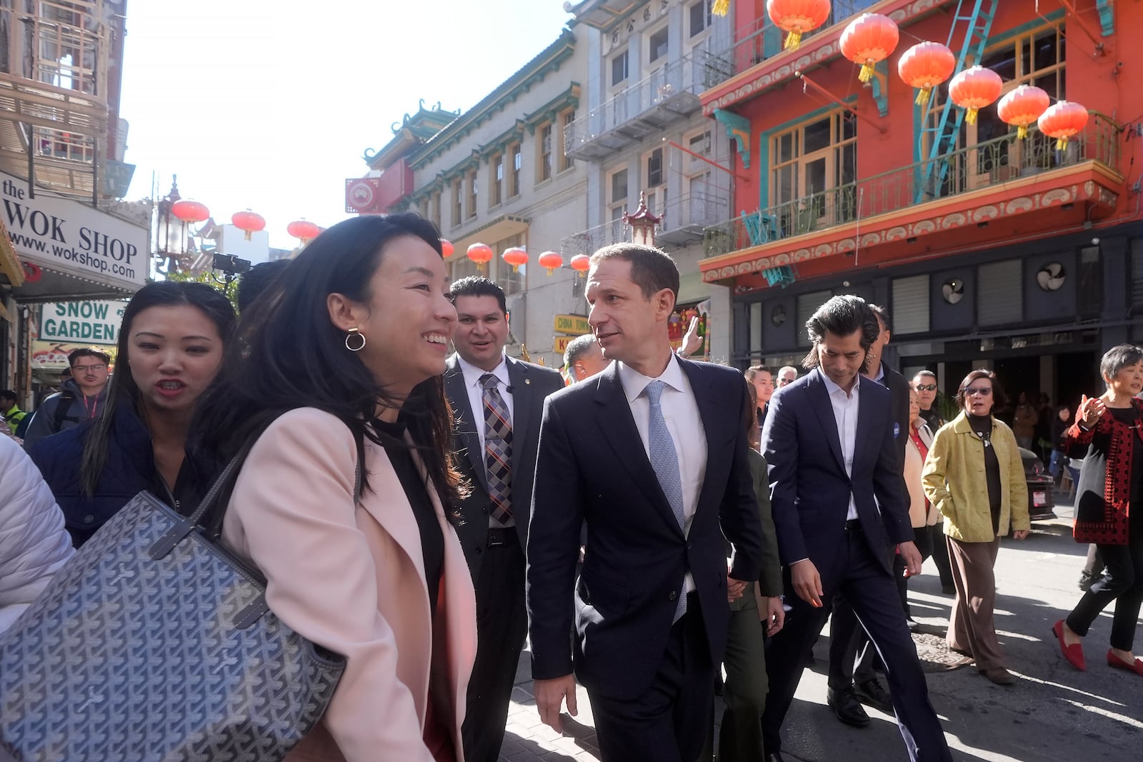 FILE - San Francisco mayoral candidate Daniel Lurie, middle, tours businesses as he walks through Chinatown in San Francisco, Friday, Nov. 8, 2024. (AP Photo/Jeff Chiu, File)