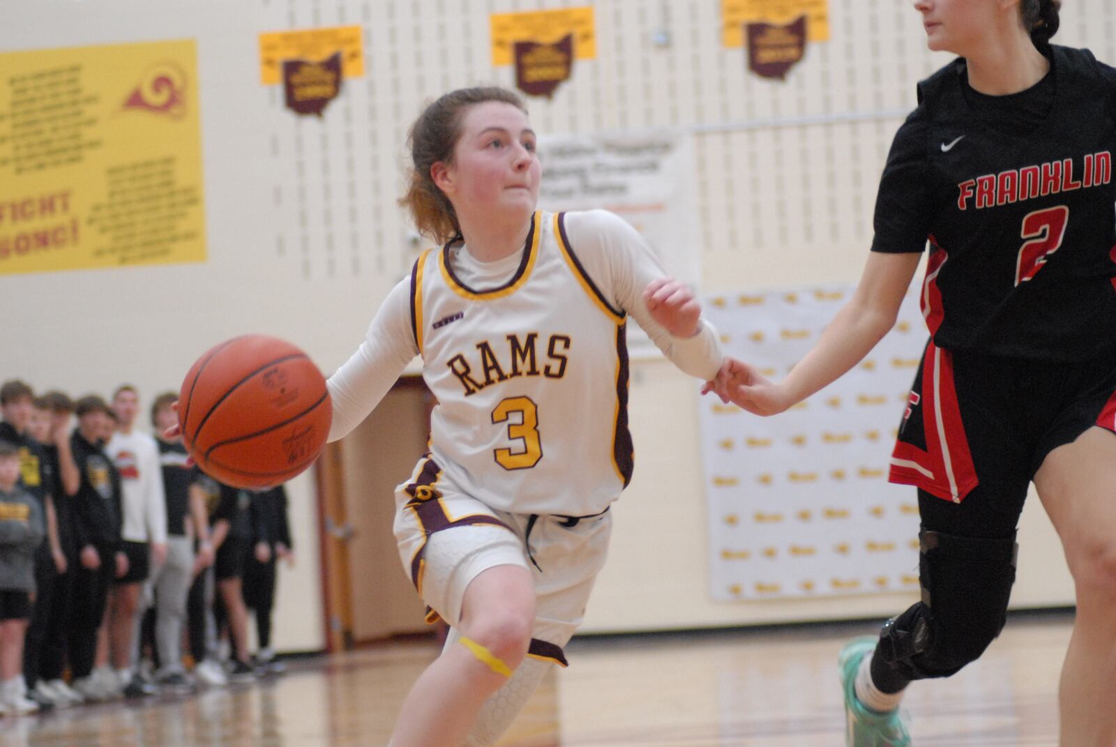Ross junior Lanie Lipps (3) drives to the hoop against Franklin senior Addie Berry (2) on Thursday night. Chris Vogt/CONTRIBUTED