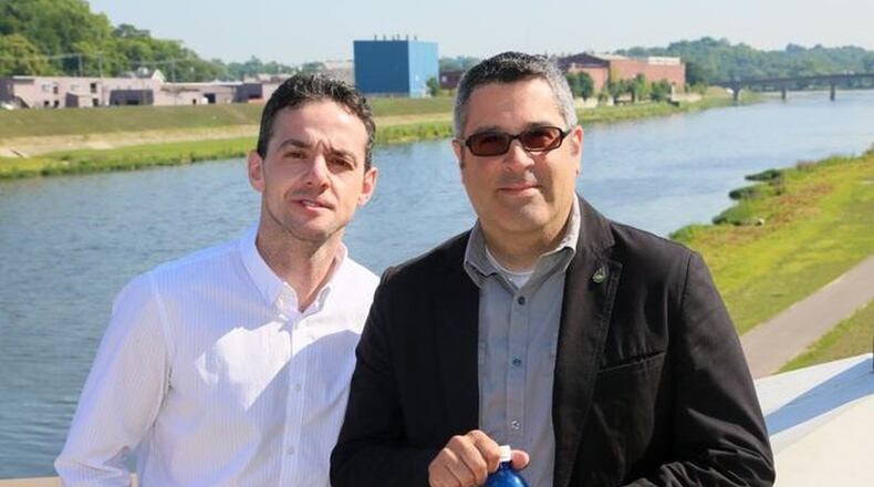 Chris Lawson, executive director of the Hamilton Mill, and Antony Seppi, Hamilton Mill operations director stand near the Great Miami River. GREG LYNCH/STAFF