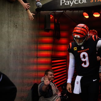 Bengals quarterback Joe Burrow runs out of the tunnel for pregame warmups before during their game against the Arizona Cardinals on Sunday, Dec. 28 at Paycor Stadium. JEREMY MILLER / CONTRIBUTED PHOTO