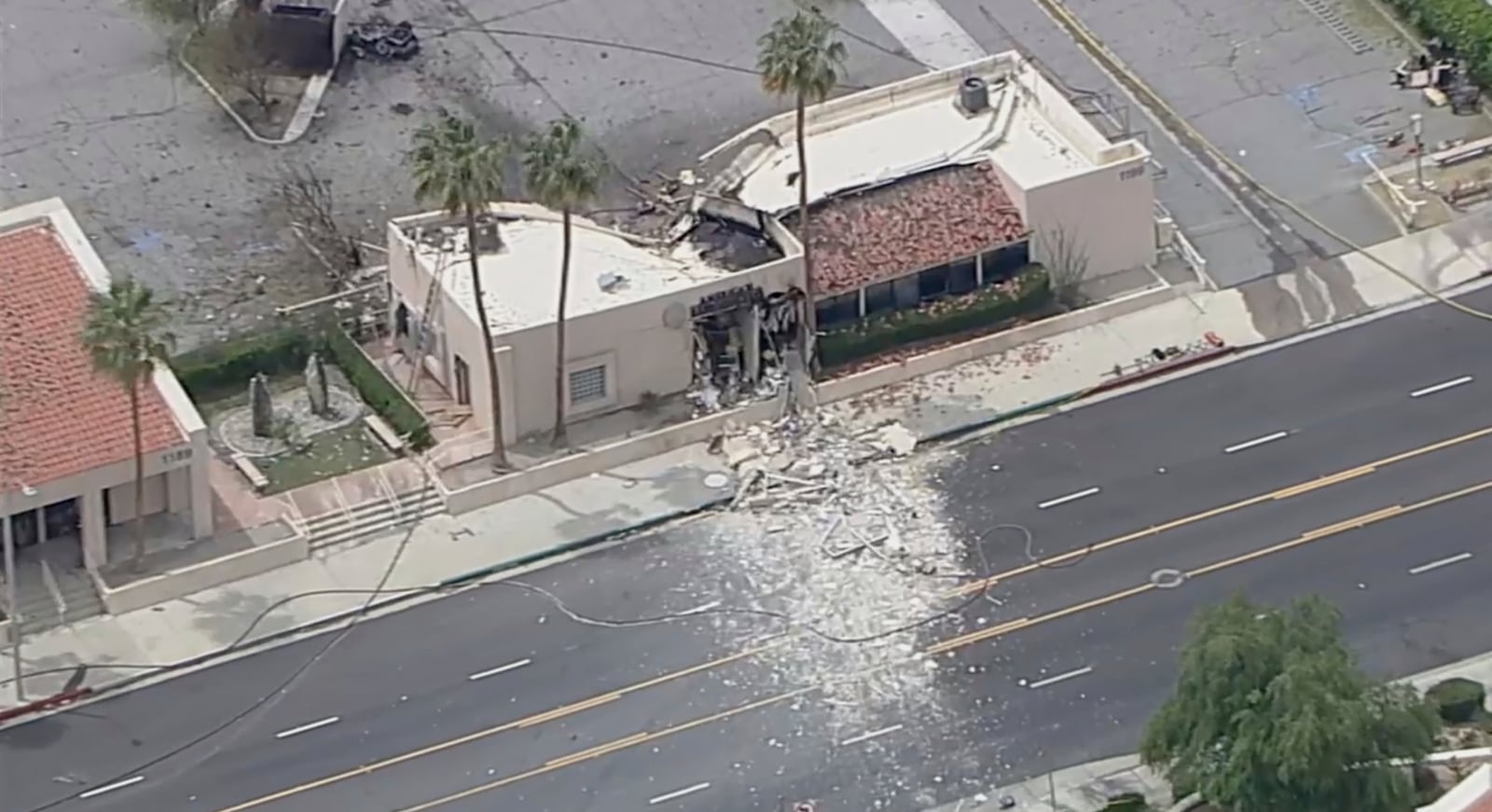 Debris covers the ground after an explosion on Saturday, May 17, 2025 in Palm Springs, Calif. (ABC7 Los Angeles via AP)