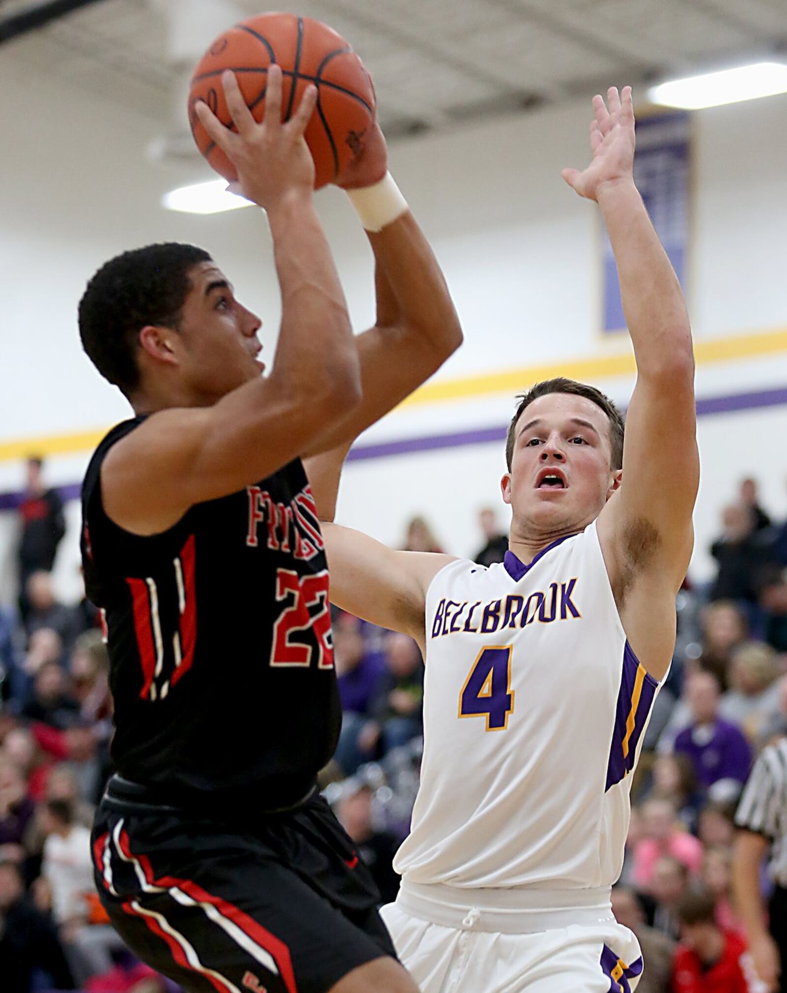 Franklin guard Ryan Montgomery gets the basket and the foul on Bellbrook forward Chandler Wren during their game at Bellbrook on Friday night. CONTRIBUTED PHOTO BY E.L. HUBBARD