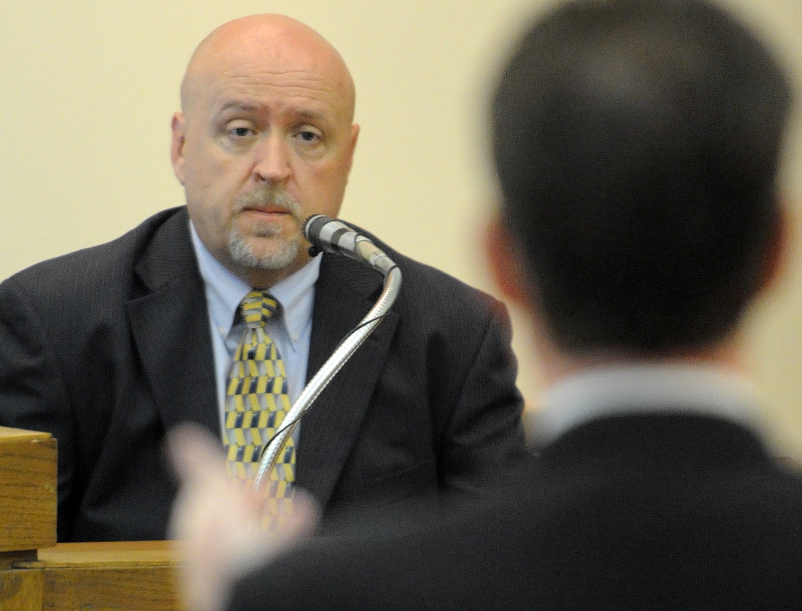 Lt. Jeff Braley, Hamilton Twp. police detective, is questioned by Ryan Widmer's attorney Jay Clark on Tues., May 18, 2010, during Widmer's second murder trial in Warren County Common Pleas Court in Lebanon.