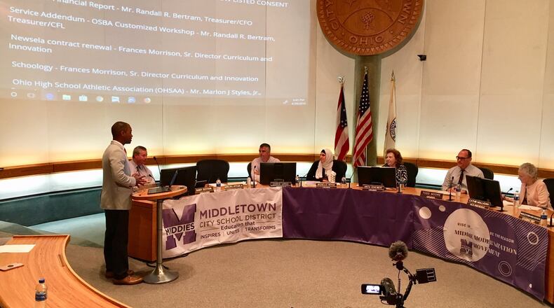 After rejecting his plan in January, Middletown school board members unanimously approved Superintendent Marlon Styles Jr. s (left at podium) revised, $10 million expansion plan of Rosa Parks Elementary at Monday evening s board meeting.