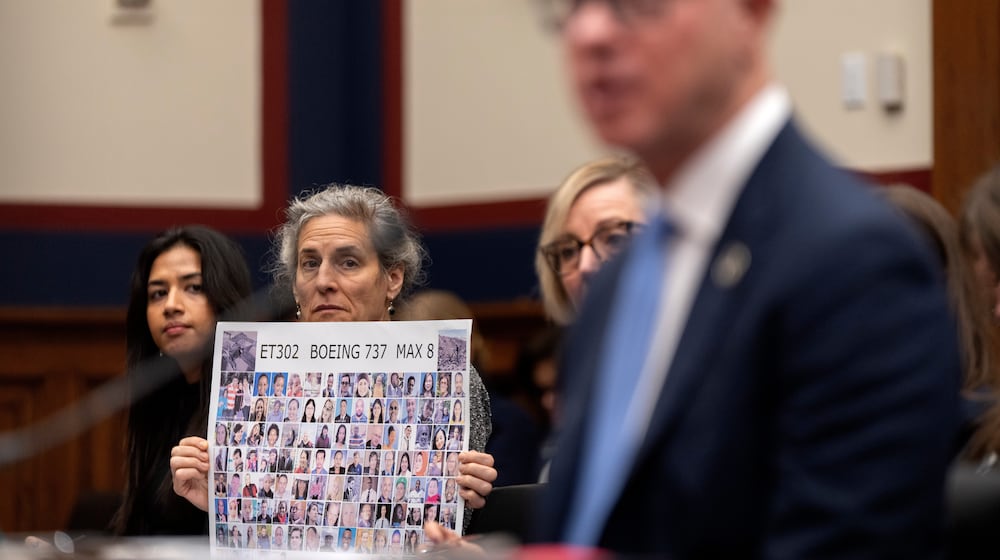 Nikita Joy of the Foundation for Aviation Safety, left, and Nadia Milleron of Sheffield, Mass., whose daughter Samya Stumo was killed in the crash of Ethiopian Airlines flight 302, listen as FAA Administrator Bryan Bedford speaks during a hearing of the Aviation Subcommittee of the House Transportation and Infrastructure Committee on Capitol Hill, Tuesday, Dec. 16, 2025, in Washington. (AP Photo/Mark Schiefelbein)