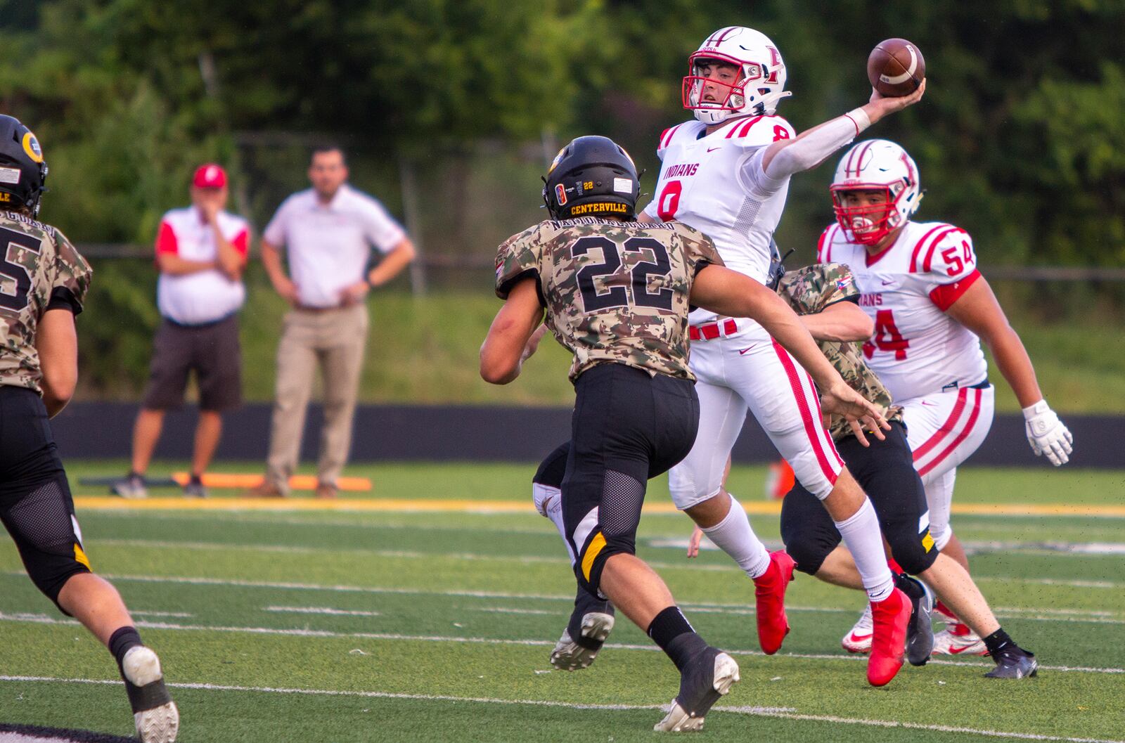 Fairfield quarterback Talon Fisher drops off a short pass that turned into a 61-yard touchdown by Nate Hannah in the first quarter Friday night at Centerville. Jeff Gilbert/CONTRIBUTED