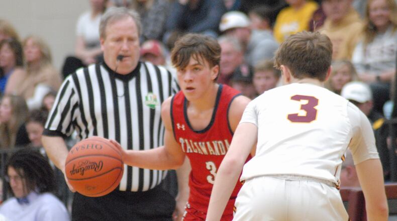 Talawanda senior Trevor Norris is guarded by Ross junior Isaac Nunn during their game on Friday night at Ross. Chris Vogt/CONTRIBUTED