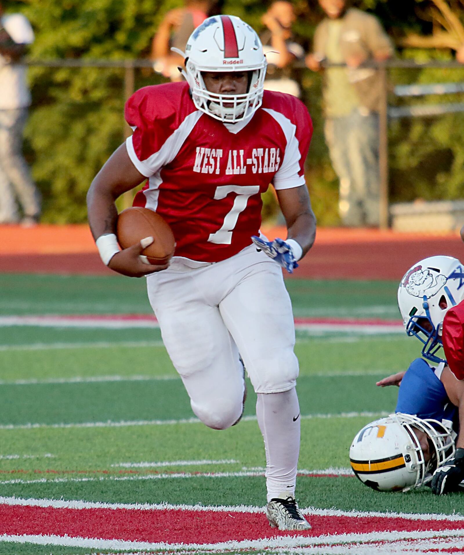 Hamilton quarterback Eric Jackson carries the ball for the West during Thursday night’s Southwestern Ohio Football Coaches Association Ron Woyan East-West All-Star Game at Kings. CONTRIBUTED PHOTO BY E.L. HUBBARD