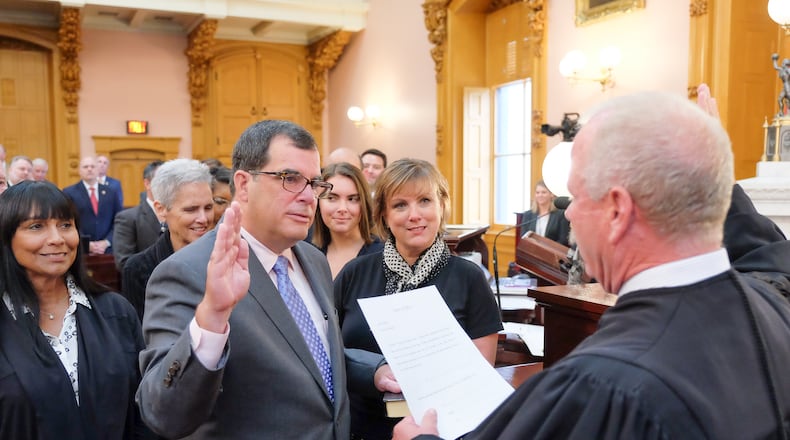 Butler County Area I Court Judge Rob Lyons administers the oath of office to Ohio Rep. George Lang, R-West Chester Twp., who on Wednesday became the representative for the 52nd Ohio House District. CONTRIBUTED