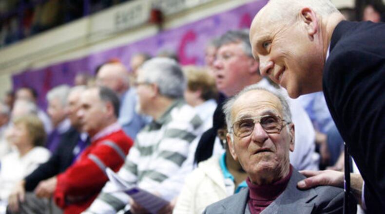 Former Middletown principal Dennis Newell talks to Jerry Nardiello during the Middletown Middies game against Hamilton in 2009 at Wade E. Miller Gymnasium in Middletown. Nardiello were there when the school retired the jersey of Jerry Lucas. FILE PHOTO