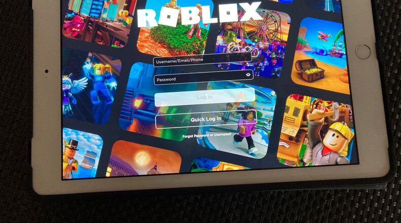 FILE - The gaming platform Roblox is displayed on a tablet, Oct. 30, 2021, in New York. (AP Photo/Leon Keith, File)