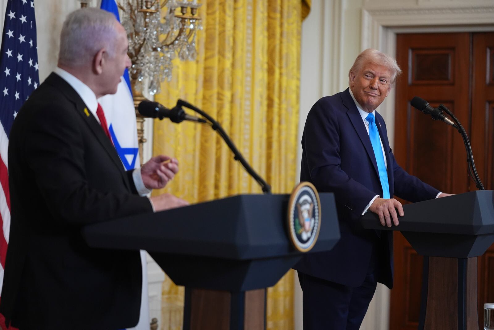 FILE - President Donald Trump listens as Israel's Prime Minister Benjamin Netanyahu speaks during a news conference in the East Room of the White House, Feb. 4, 2025, in Washington. (AP Photo/Evan Vucci, File)
