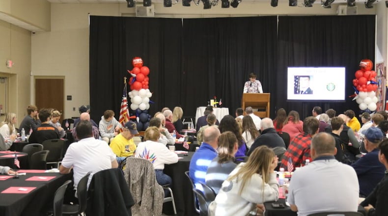 Fenwick High School's Cooper Mulligan delivers the "Missing Man" prayer during the school's veterans breakfast and ceremony. SUBMITTED PHOTO