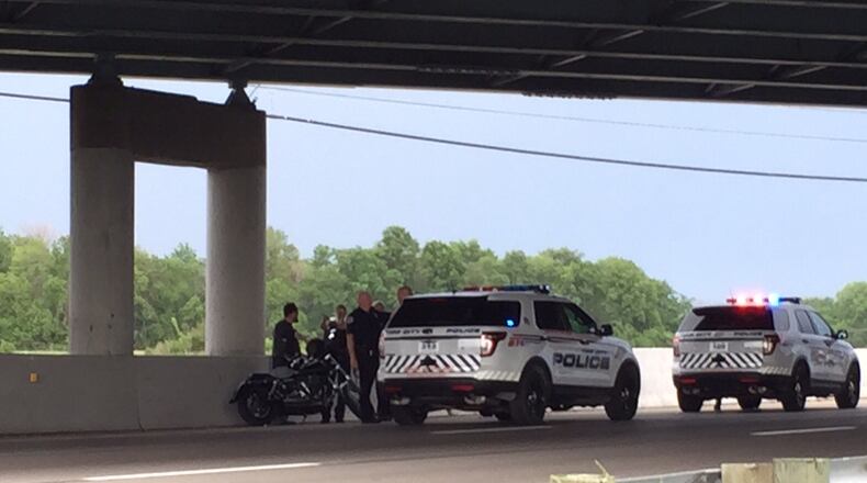 FILE PHOTO: Motorcyclists talk to police on south Interstate 75 at the County Road 25A overpass in Miami County after a hit-and-run crash involving a car that struck members of a group of motorcyclists riding together May 30, 2015. (Drew Simon/Staff)