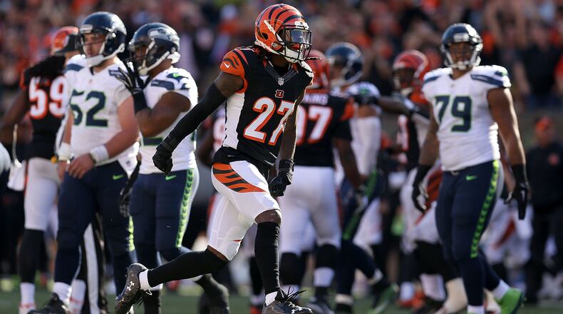 CINCINNATI, OH - OCTOBER 11: Dre Kirkpatrick #27 of the Cincinnati Bengals celebrates after sacking Russell Wilson #3 of the Seattle Seahawks during overtime at Paul Brown Stadium on October 11, 2015 in Cincinnati, Ohio. Cincinnati defeated Seattle 27-24 in overtime. (Photo by Andy Lyons/Getty Images)