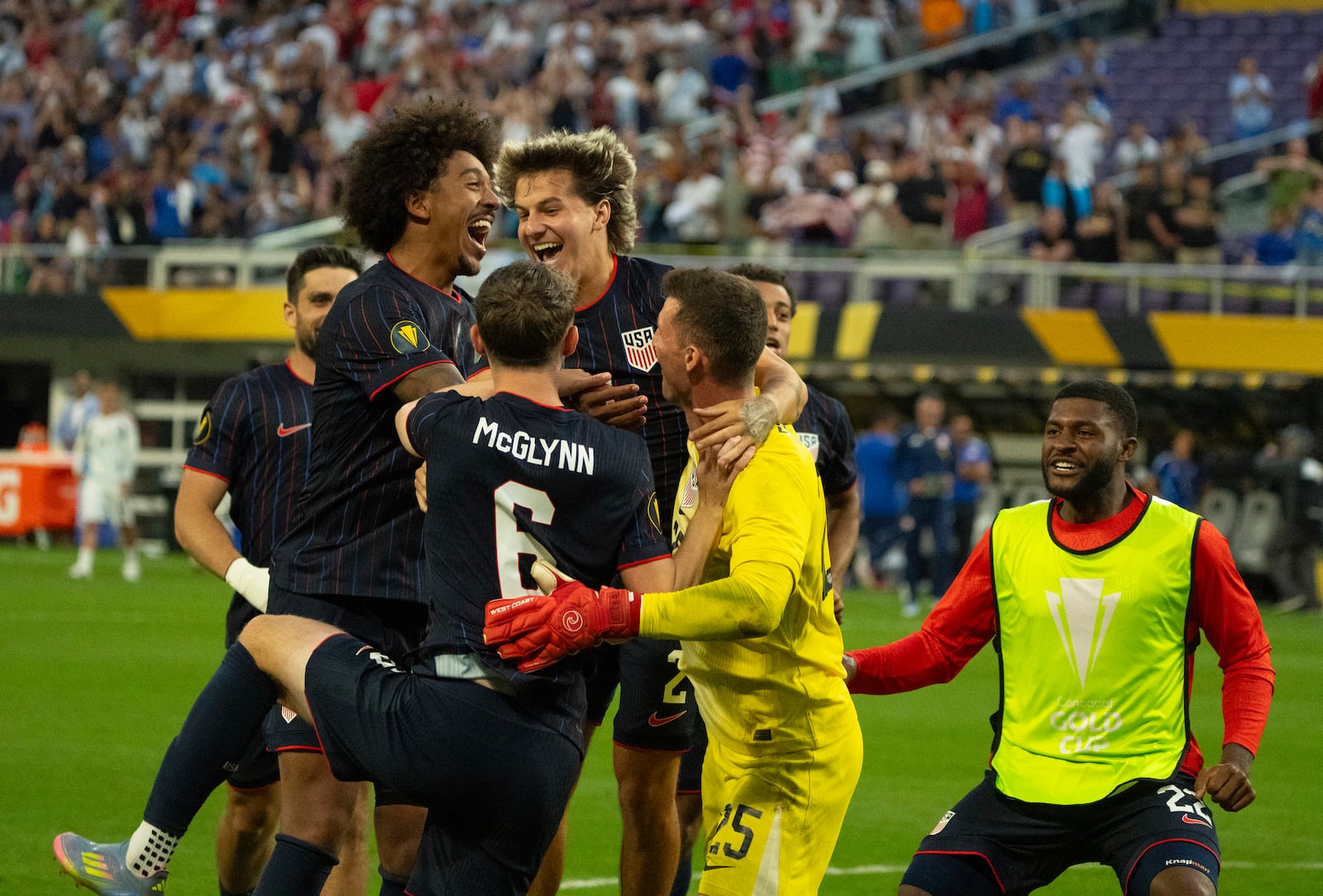 United States goalkeeper Matthew Freese (25) is congratulated after he saved enough Costa Rica penalty kicks for his team to prevail in a CONCACAF Gold Cup quarterfinals soccer match Sunday, June 29, 2025, in Minneapolis. (Jeff Wheeler/Star Tribune via AP)