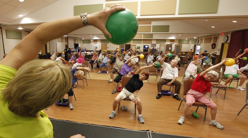 People take part in a Silver Sneakers Fitness Program. STAFF